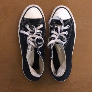 Black, high top Chuck Taylors